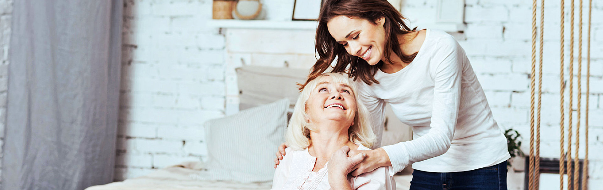 caregiver and senior looking at each other