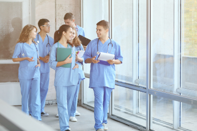 group of nurse walking to the hall at the hospital